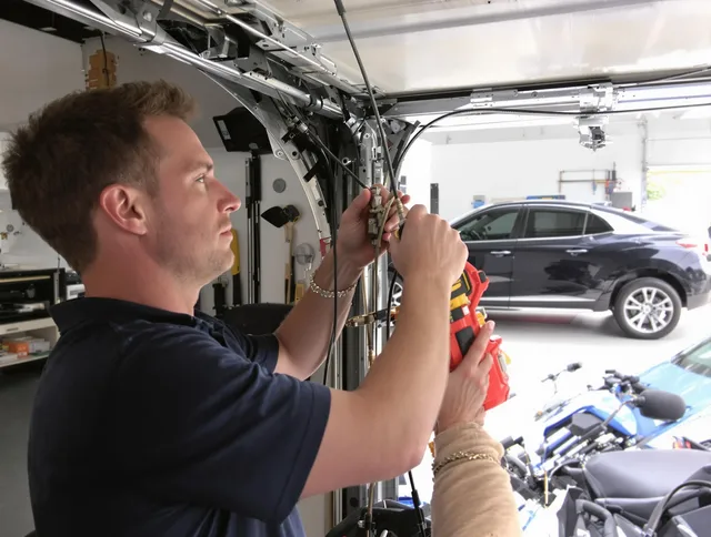 Concord Garage Door Repair safety certified technician performing cable replacement in Concord